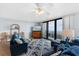 Ocean-view living room with comfy sofas and rug at 4139 S Atlantic Ave # B103, New Smyrna Beach, FL 32169