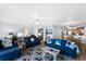Relaxing living room with blue sofas, ocean view, and comfy seating at 4139 S Atlantic Ave # B103, New Smyrna Beach, FL 32169