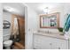 Updated bathroom with a shower and white vanity at 4139 S Atlantic Ave # B103, New Smyrna Beach, FL 32169