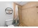 Clean bathroom with a shower and tile flooring at 4139 S Atlantic Ave # B103, New Smyrna Beach, FL 32169