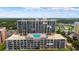Aerial view showcasing beachfront building and pool at 4139 S Atlantic Ave # B103, New Smyrna Beach, FL 32169