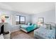 Guest bedroom with two twin beds and ocean view at 4139 S Atlantic Ave # B103, New Smyrna Beach, FL 32169