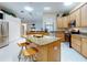 Large kitchen with granite island and stainless steel appliances at 1780 Otisco Way, Winter Springs, FL 32708