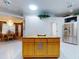 Large kitchen island with granite countertops, perfect for casual dining at 1780 Otisco Way, Winter Springs, FL 32708