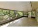 Spacious screened porch overlooking a wooded area at 4660 Holly Rd, New Smyrna Beach, FL 32168