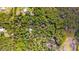 Aerial view showing property lines of a home in a wooded area at 4660 Holly Rd, New Smyrna Beach, FL 32168