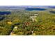 Aerial view showing property lines of a home nestled in a wooded area at 4660 Holly Rd, New Smyrna Beach, FL 32168