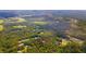 Aerial view showing property lines of a home in a wooded area at 4660 Holly Rd, New Smyrna Beach, FL 32168