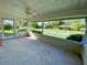 Relaxing screened porch overlooking the neighborhood at 101 Braeburn Cir, Daytona Beach, FL 32114