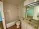 Clean bathroom with a bathtub, toilet, and vanity at 101 Braeburn Cir, Daytona Beach, FL 32114