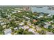Wide aerial view of the property and surrounding neighborhood, near the water at 412 S Peninsula Ave, New Smyrna Beach, FL 32169