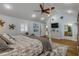 Main bedroom with king bed, built-in storage, and hardwood floors at 412 S Peninsula Ave, New Smyrna Beach, FL 32169