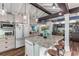 Open concept kitchen boasting an island, white cabinetry, and high ceilings at 412 S Peninsula Ave, New Smyrna Beach, FL 32169