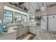 Modern kitchen with granite countertops, ample cabinetry, and a breakfast bar at 412 S Peninsula Ave, New Smyrna Beach, FL 32169