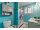 Bathroom with gray vanity, shower, and beach-themed decor at 412 S Peninsula Ave, New Smyrna Beach, FL 32169