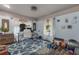 Home office with a workspace, fitness equipment, and starfish rug at 412 S Peninsula Ave, New Smyrna Beach, FL 32169