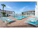 Inviting outdoor space with a turquoise pool and plenty of room for lounging at 3509 S Atlantic Ave # 209, New Smyrna Beach, FL 32169