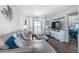 Living room with sectional sofa and access to balcony at 3509 S Atlantic Ave # 209, New Smyrna Beach, FL 32169
