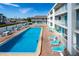 Resort-style pool with plenty of lounge chairs for relaxing in the sun at 3509 S Atlantic Ave # 209, New Smyrna Beach, FL 32169