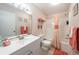 Clean bathroom with tub/shower combo and coral decor at 3509 S Atlantic Ave # 209, New Smyrna Beach, FL 32169
