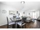 Dining area with table and chairs, adjacent to living room at 3509 S Atlantic Ave # 209, New Smyrna Beach, FL 32169