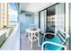 Enjoy ocean views from this balcony, featuring a table and chairs at 3509 S Atlantic Ave # 209, New Smyrna Beach, FL 32169