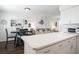 Kitchen features a breakfast bar and view into the living room at 3509 S Atlantic Ave # 209, New Smyrna Beach, FL 32169