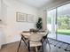 White round table with four chairs in a bright dining area at 3975 Willowbrook Dr, Edgewater, FL 32141