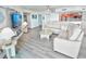 Relaxing living room with a sectional sofa, large TV, and ocean views at 241 Riverside Dr # 510, Holly Hill, FL 32117