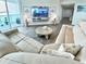 Living room features a large sectional sofa, a coffee table, and a built-in entertainment center at 241 Riverside Dr # 510, Holly Hill, FL 32117