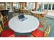 Community room with tables and chairs, perfect for gatherings at 241 Riverside Dr # 510, Holly Hill, FL 32117