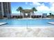 Resort-style pool with lounge chairs and palm trees at 241 Riverside Dr # 510, Holly Hill, FL 32117