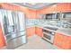 Modern kitchen with stainless steel appliances and mosaic backsplash at 241 Riverside Dr # 510, Holly Hill, FL 32117