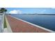 Brick-paved waterfront walkway with water views at 241 Riverside Dr # 510, Holly Hill, FL 32117