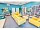 Relax and unwind in the community reading room with comfortable seating and bookshelves at 241 Riverside Dr # 510, Holly Hill, FL 32117