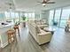 Spacious living room with large windows, recessed lighting and comfortable seating at 241 Riverside Dr # 510, Holly Hill, FL 32117