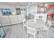 Open living room with sectional sofa and dining area at 241 Riverside Dr # 510, Holly Hill, FL 32117