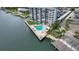 Aerial view of waterfront building with pool and private boat dock at 101 N Riverside Dr # 4140, New Smyrna Beach, FL 32168