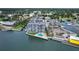 Aerial view of waterfront property, pool, and marina at 101 N Riverside Dr # 4140, New Smyrna Beach, FL 32168
