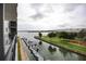 Stunning view of the waterway, boats, and bridge from private balcony at 101 N Riverside Dr # 4140, New Smyrna Beach, FL 32168
