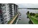 View of building and private boat docks along the waterway at 101 N Riverside Dr # 4140, New Smyrna Beach, FL 32168