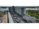 Aerial view of a waterfront building with ample parking at 101 N Riverside Dr # 4140, New Smyrna Beach, FL 32168