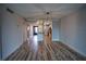 Open living area with kitchen view and wood-look floors at 101 N Riverside Dr # 4140, New Smyrna Beach, FL 32168