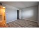 Spacious bedroom with wood-look flooring and access to bathroom at 101 N Riverside Dr # 4140, New Smyrna Beach, FL 32168