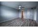 Spacious bedroom with wood-look floors and en-suite bathroom at 101 N Riverside Dr # 4140, New Smyrna Beach, FL 32168