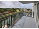 Balcony overlooks canal, landscaping and street at 101 N Riverside Dr # 4140, New Smyrna Beach, FL 32168