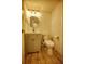 Updated bathroom with vanity, toilet and wood-look flooring at 101 N Riverside Dr # 4140, New Smyrna Beach, FL 32168
