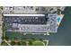 Aerial view of building highlighting parking, pool, and boat docks at 101 N Riverside Dr # 4140, New Smyrna Beach, FL 32168