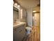 Updated bathroom with gray vanity, white toilet and walk-in shower at 101 N Riverside Dr # 4140, New Smyrna Beach, FL 32168