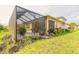 Enclosed pool area with lush landscaping at 306 Coral Reef Way, Daytona Beach, FL 32124